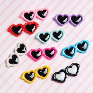 Collection of colorful heart-shaped mini sunglasses for dolls and DIY accessories