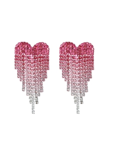 Macro shot of pink gradient rhinestone heart earrings with long fringe tassels