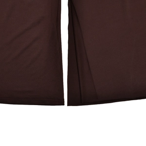 Detail of the double-needle stitched hem on a dark brown slim fit knitted dress