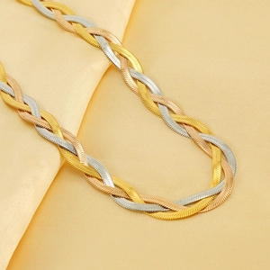 Three-tone braided herringbone necklace in gold, silver and rose gold on silk background