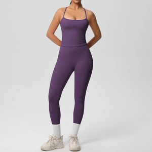 Detail of high-waisted deep purple yoga set with sports camisole and compression leggings