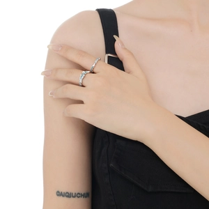Set of two irregular wavy S925 sterling silver rings with blue enamel texture details