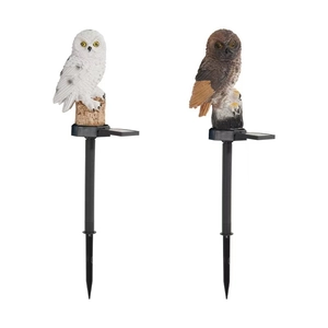 Solar powered resin owl garden lights in white and brown with stake for outdoor landscape