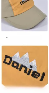 Detailed macro view of fine Daniel embroidery on quick-dry color-block kid's baseball cap