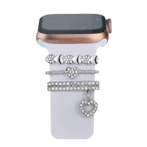 Silver rhinestone apple watch band charms with moon and heart charms on white strap