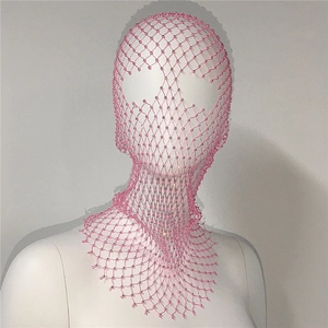 Macro detail of pink fishnet headpiece with sparkling rhinestones for festival wear