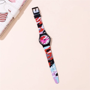Detailed top view of a stylish camo quartz watch with vibrant red and blue silicone strap