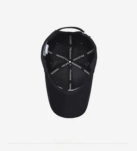 Detailed view of black baseball cap interior with branded stitching and inner labels