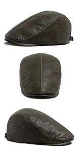 Detailed side view of vintage PU leather beret with metal air vents and stitching
