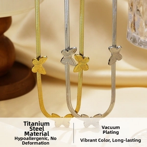 Detail of titanium steel butterfly pendants with vacuum plating in gold and silver