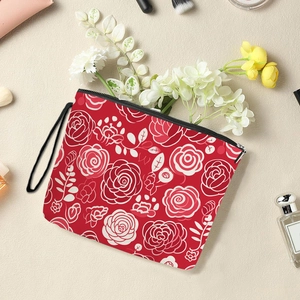 Floral makeup bag with red rose pattern, functional zipper closure and wrist strap
