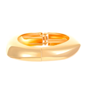 Detail showing the polished gold geometric hinge opening of the wide metal bangle