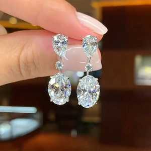 Silver teardrop drop earrings with sparkling pear and oval cut clear crystals