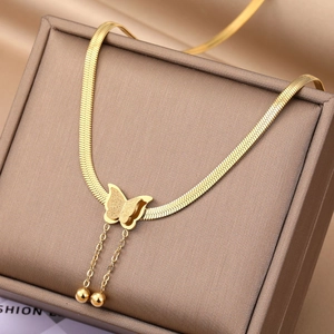Detail of gold double-layer butterfly necklace with bead tassels on flat snake chain