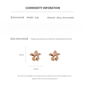 Detailed view of golden irregular flower earrings showing 3.6cm by 3.4cm dimensions