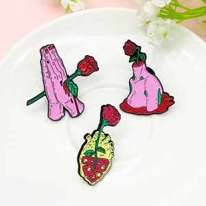 Creative alloy enamel brooch set featuring red roses growing from hands, hearts and neck