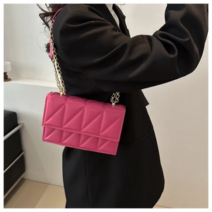 Chic pink quilted chain strap crossbody bag for women with geometric stitching patterns