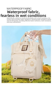 Waterproof cream diaper backpack showing water-repellent fabric and detachable pouch