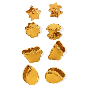Set of four pairs of gold-plated titanium steel earrings in star, flower, butterfly, and drop shapes