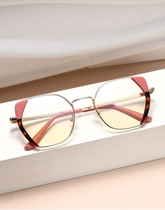 Detail view of rose gold square optical frames with pink brow and tortoiseshell temples