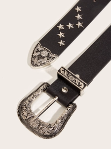 Detail of western style black belt with vintage floral buckle and star rivets decoration