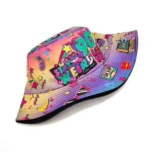 Detail of 90s retro bucket hat showing colorful pop art prints and STAY WEIRD text