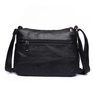 Black washed leather shoulder bag for women featuring multiple pockets and adjustable strap