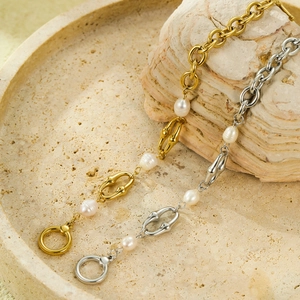 Elegant 18K gold and silver titanium chain bracelet with pearl and horsebit link style