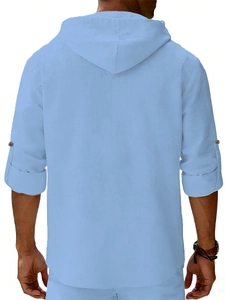 Back view of light blue linen hooded shirt with adjustable sleeves and box pleat detail