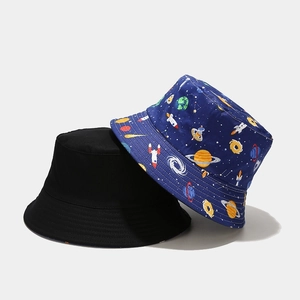Reversible Japanese style bucket hat with cartoon space print and solid black color