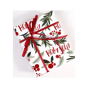 Christmas gift box with Holly Jolly print, red ribbon bow and a small pearl accent