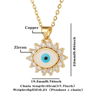Macro detail of gold Evil Eye necklace with zircon inlay and product measurements