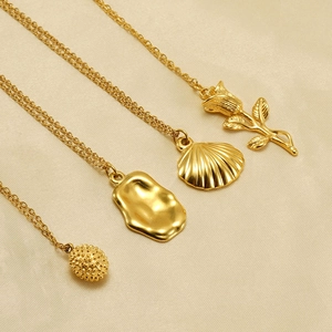 Golden stainless steel necklaces with rose, shell and irregular lava pendants for women