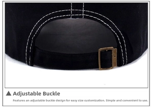 Detail of black cotton baseball cap with adjustable bronze metal slider buckle and white stitching