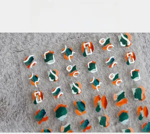 Detail of 5D ultra-thin nail art stickers with abstract green and orange graffiti lines