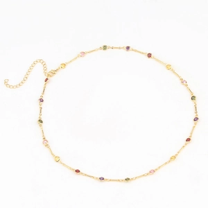Detail of gold-plated necklace with vibrant multi-colored crystals and adjustable clasp