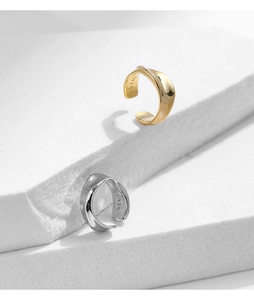 Detail view of S925 sterling silver stamp on liquid metal gold and silver ear clips