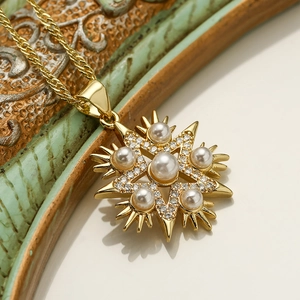 Elegant gold star pendant necklace with round pearls and sparkling cubic zirconia stones