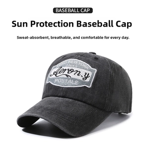Detailed macro view of vintage dark grey washed cotton baseball cap with retro embroidery
