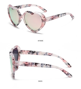 Detail view of heart-shaped sunglasses with pink floral temples from 45-degree and back