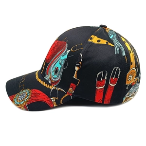Side view of black baseball cap featuring retro floral chain print and curved brim details