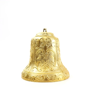 Golden Christmas bell ornament with embossed star patterns and hanging ring on white background