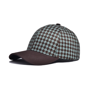 Detail of teal and brown houndstooth baseball cap with reinforced stitched brim