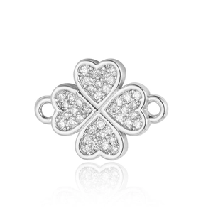 Close-up of silver four-leaf clover charm with sparkling cubic zirconia pavé setting