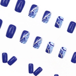 Medium-length blue marble press-on nails with silver glitter lines and square shape