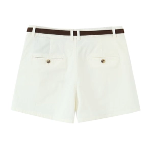 Close-up of white pleated shorts with brown leather belt and detailed back pockets