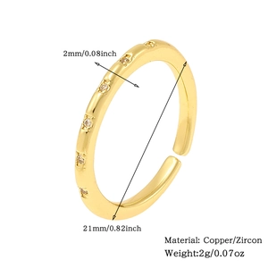 Detail view of gold zircon ring with size measurements 2mm thickness and 21mm diameter