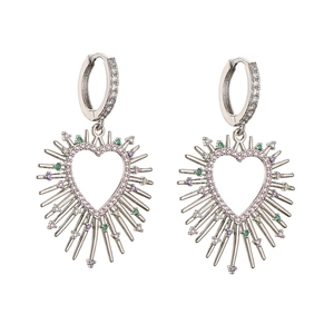 Detail of silver spiked heart earrings with colorful zircon stones on white background
