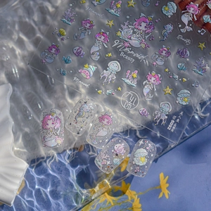 Close-up of Mermaid Beauty TO-5092 nail art stickers with iridescent shell light effect