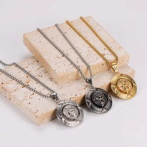 Embossed lion head necklaces in silver and gold hanging on stone blocks with box chains